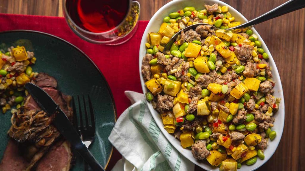italian sausage succotash on a serving plate