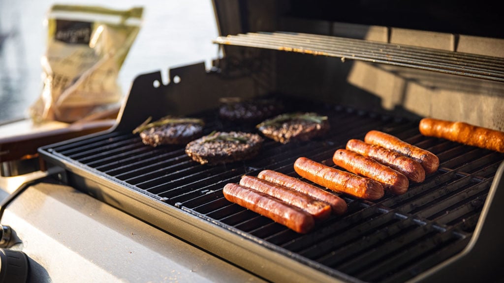 burgers and dogs on grill