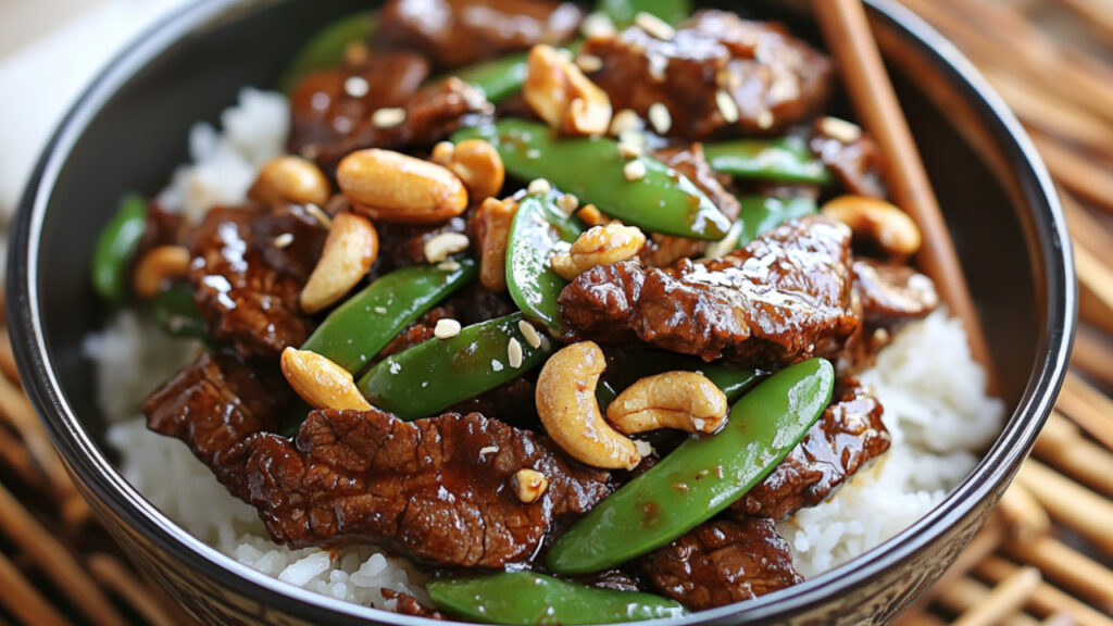 Mongolian Beef with Snow Peas and Cashews in a bowl