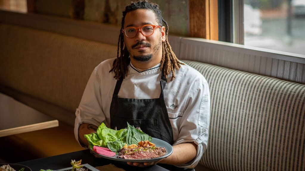 angel barreto of anju with his flank steak ssam board