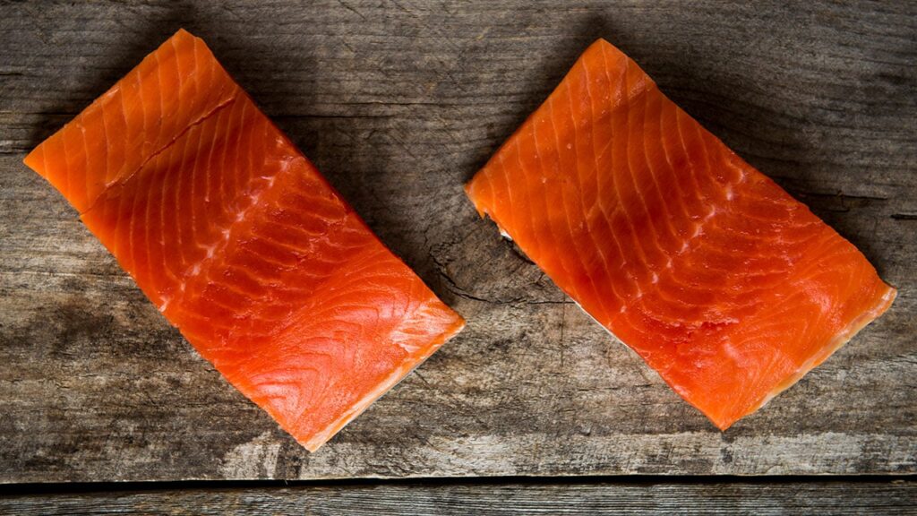 raw salmon on a wooden table